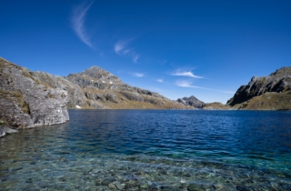 A Lake's Serenity in the Heart of Ancient Peaks